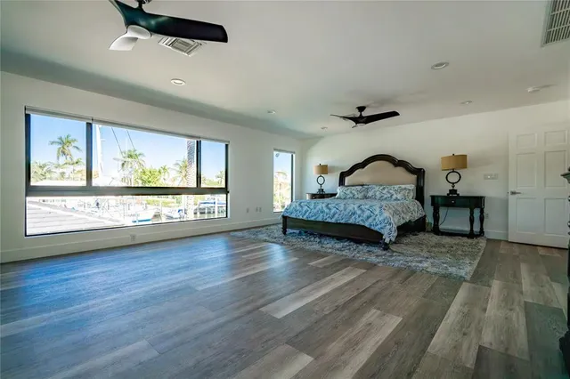 a bedroom with a bed dresser and a window