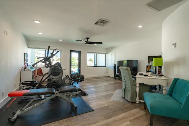 a view of a house with swimming pool and sitting area