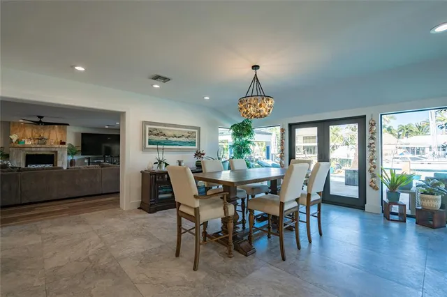 a living room with furniture and a kitchen
