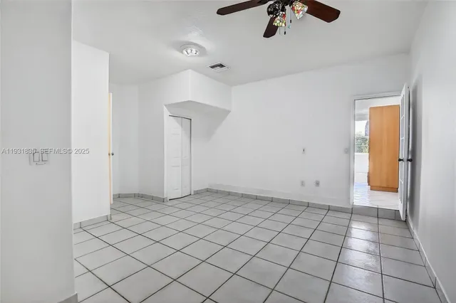 a view of an empty room and window