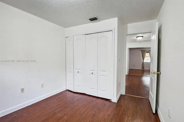 a utility room with closet dryer and washer
