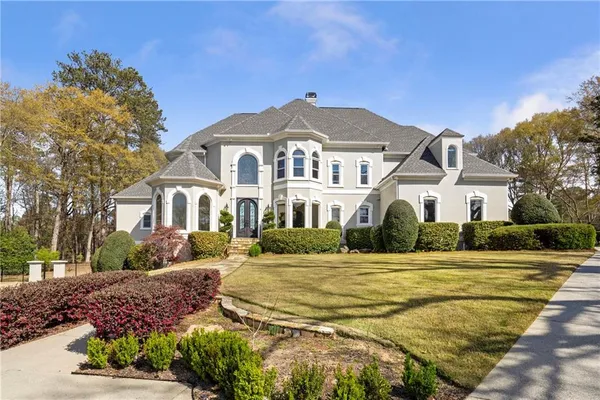 a front view of a house with a yard
