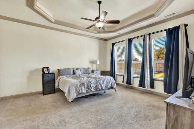 12901 Smokey Ranch Drive Fort Worth, TX 76052 - Photo 17 of 40 a bed sitting in a spacious bedroom next to a window