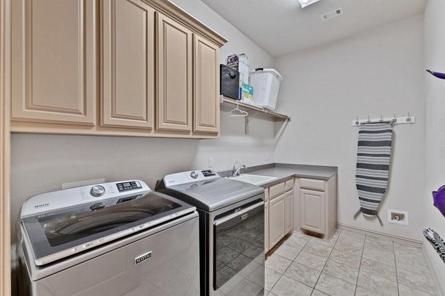 12901 Smokey Ranch Drive Fort Worth, TX 76052 - Photo 24 of 40 a kitchen with a stove and a sink