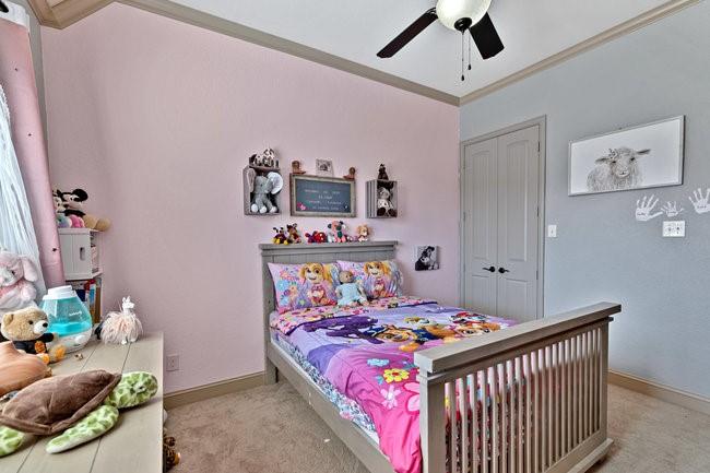 12901 Smokey Ranch Drive Fort Worth, TX 76052 - Photo 27 of 40 a bed room with a bed and a baby bed