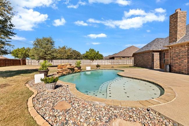 12901 Smokey Ranch Drive Fort Worth, TX 76052 - Photo 30 of 40 a view of a swimming pool with a lake view