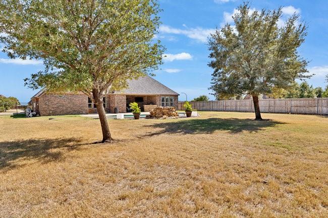 12901 Smokey Ranch Drive Fort Worth, TX 76052 - Photo 32 of 40 a view of yard with tree in front of it