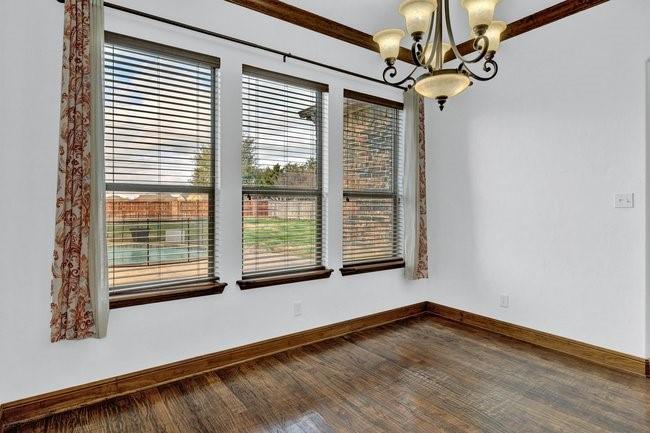 12901 Smokey Ranch Drive Fort Worth, TX 76052 - Photo 9 of 40 a view of empty room with wooden floor and fan