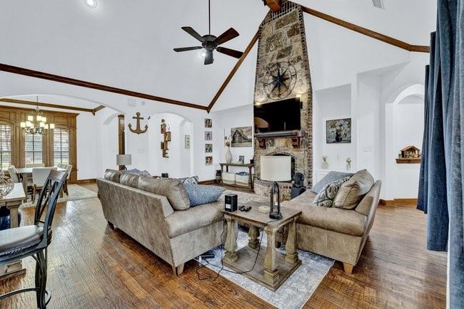 12901 Smokey Ranch Drive Fort Worth, TX 76052 - Photo 10 of 40 a living room with furniture a flat screen tv and a fireplace