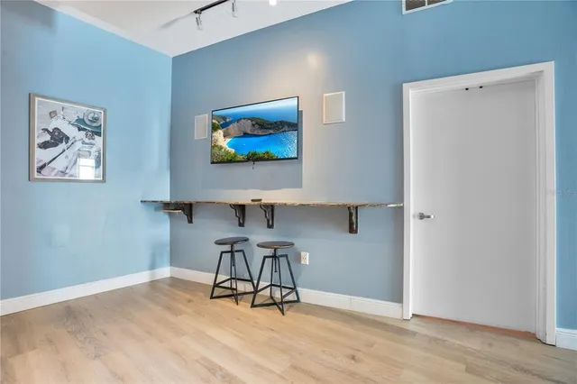 a view of a dining room with a table and chair