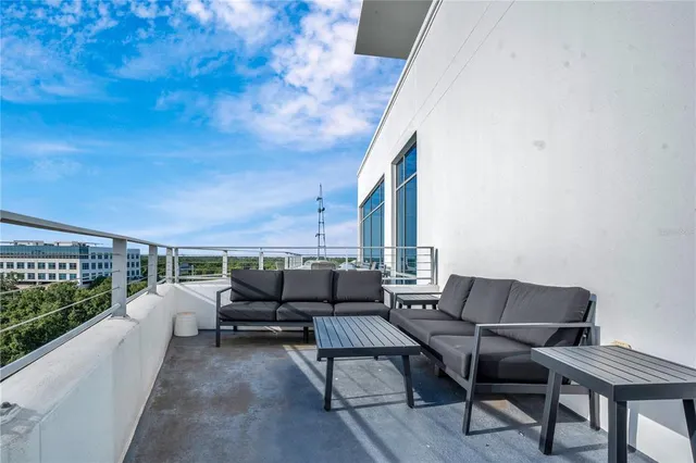 a bathroom with a double vanity sink a large mirror and shower