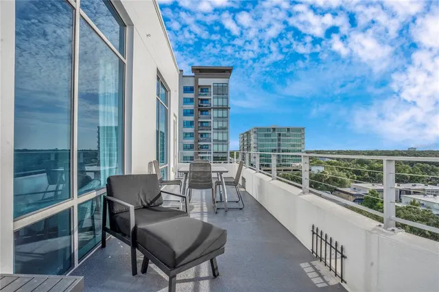 a bathroom with a granite countertop sink mirror and shower