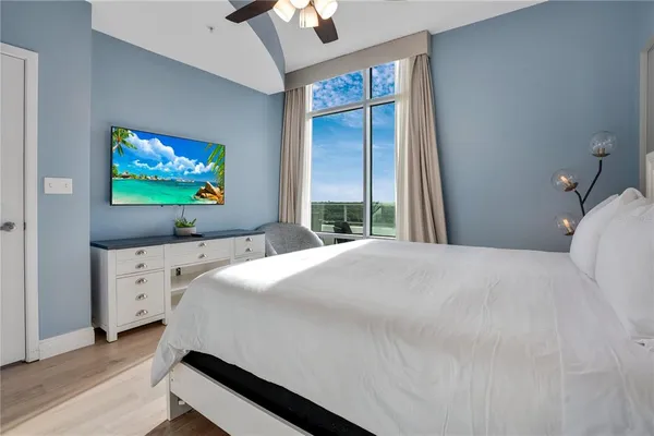 a bedroom with a bed and window