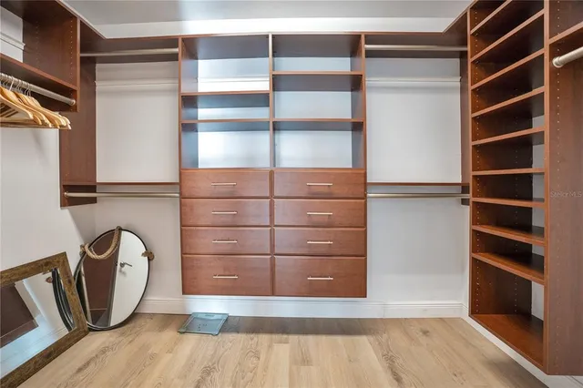 a dining room with furniture and a floor to ceiling window