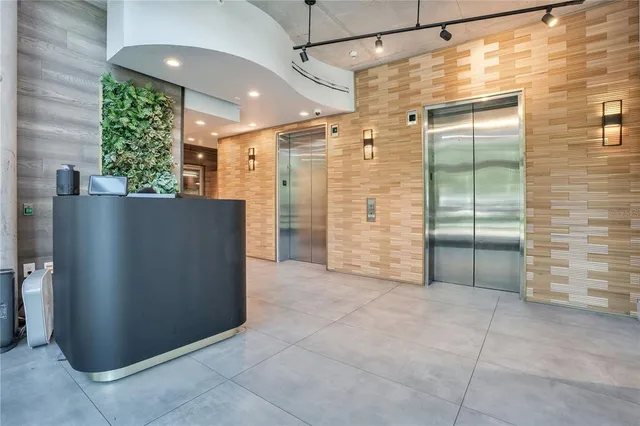 a view of an entryway with wooden floor