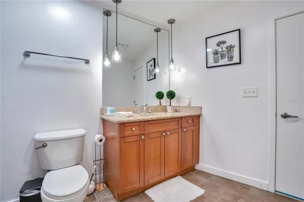 a living room with furniture and floor to ceiling windows