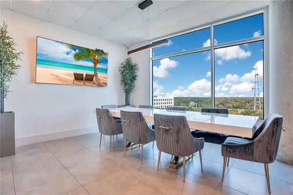 a bedroom with furniture and a flat screen tv