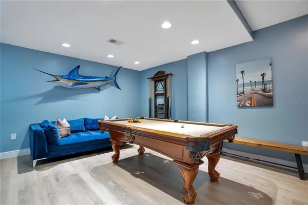 a kitchen with granite countertop a refrigerator stove top oven and sink