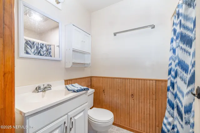 a bathroom with a sink toilet and vanity