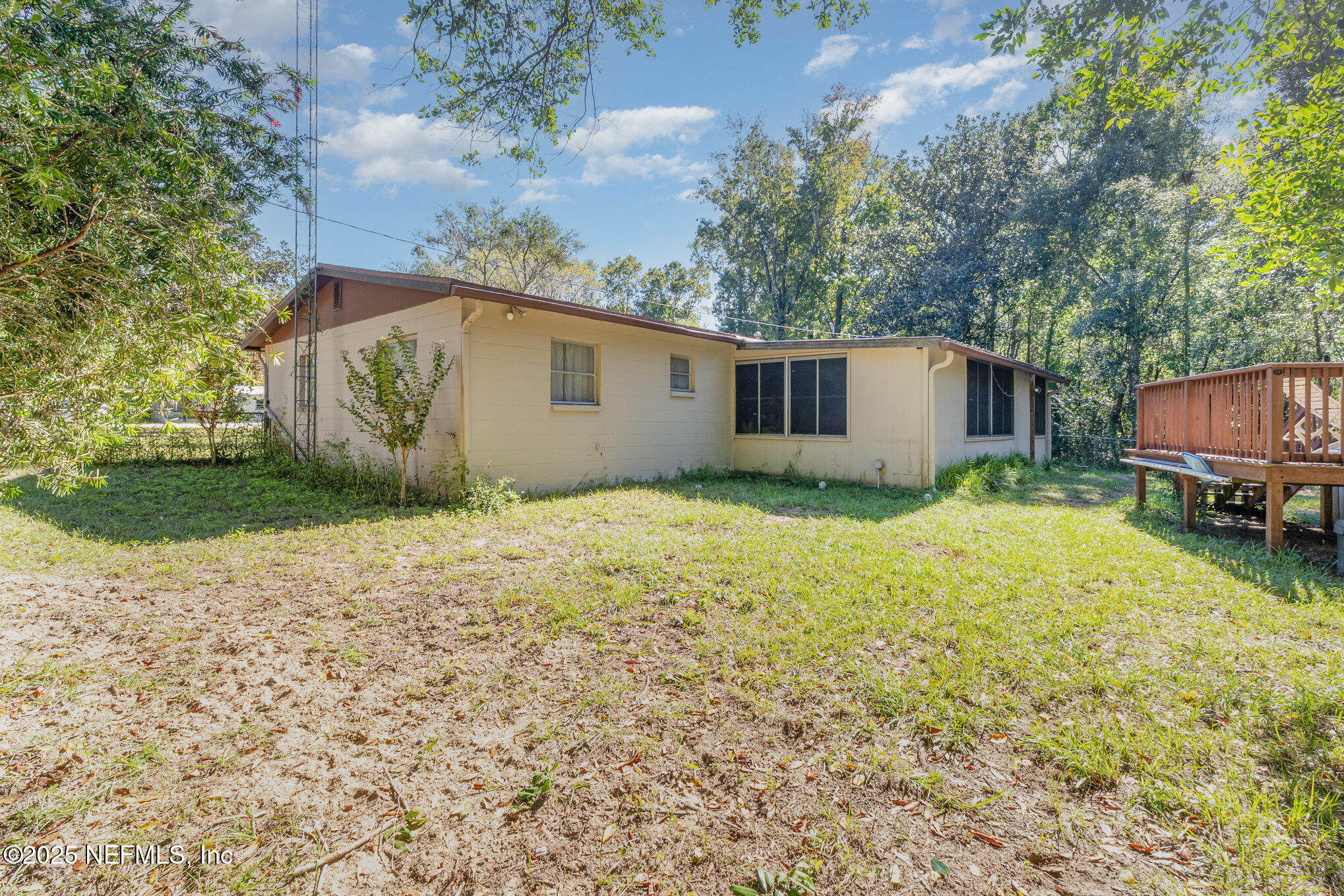 1330 Northeast 157 Avenue Williston, FL 32696 - Photo 20 of 22 a backyard of a house with yard and outdoor seating
