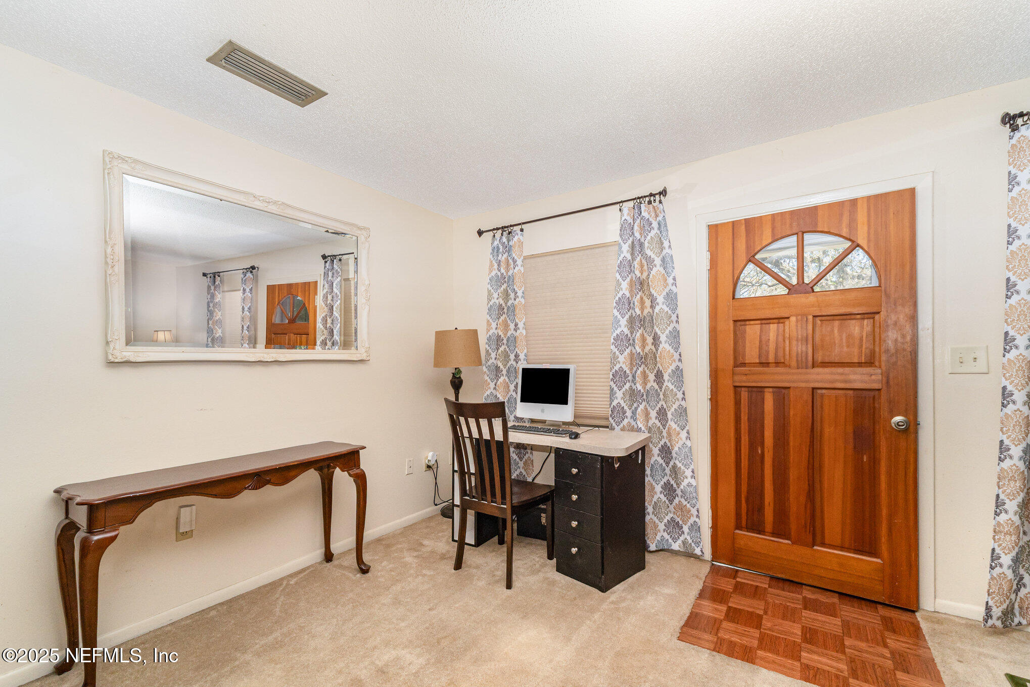 1330 Northeast 157 Avenue Williston, FL 32696 - Photo 4 of 22 a view of a workspace with furniture and a window