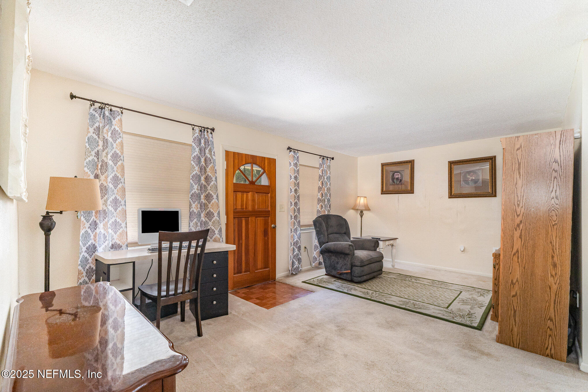1330 Northeast 157 Avenue Williston, FL 32696 - Photo 5 of 22 a living room with furniture and a flat screen tv