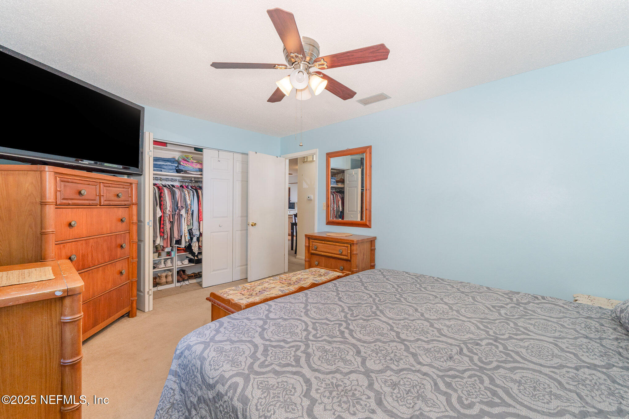 1330 Northeast 157 Avenue Williston, FL 32696 - Photo 10 of 22 a bedroom with a bed and a flat screen tv