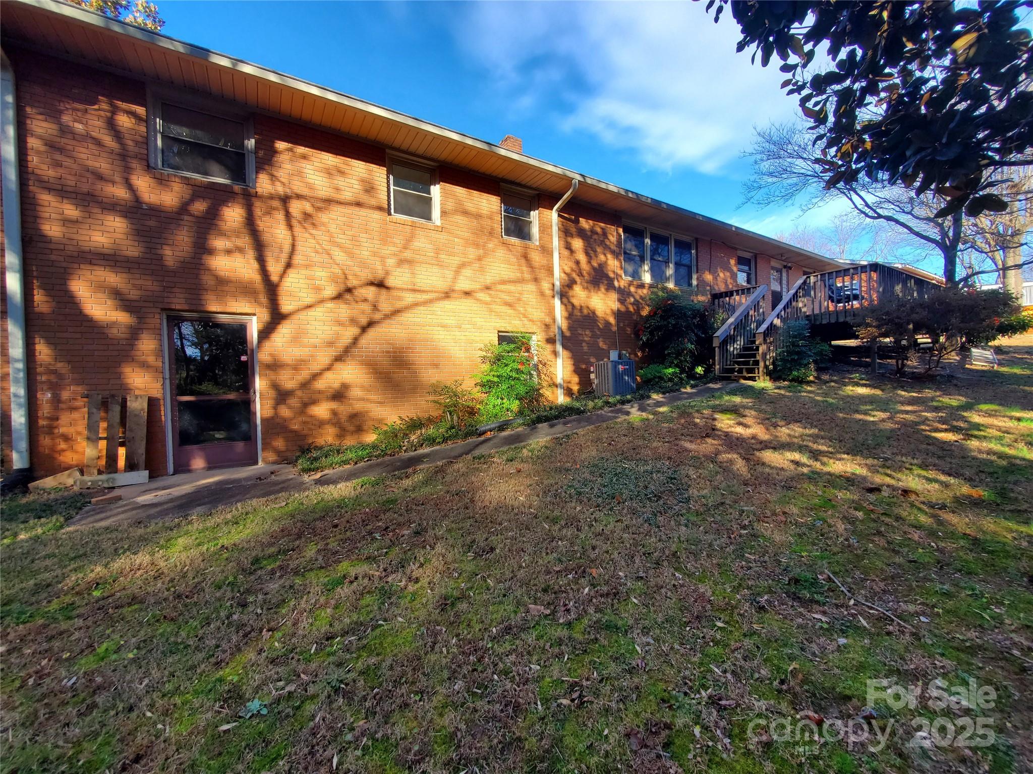 1303 Hunt Street Shelby, NC 28152 - Photo 12 of 16 a backyard of a house with lots of green space