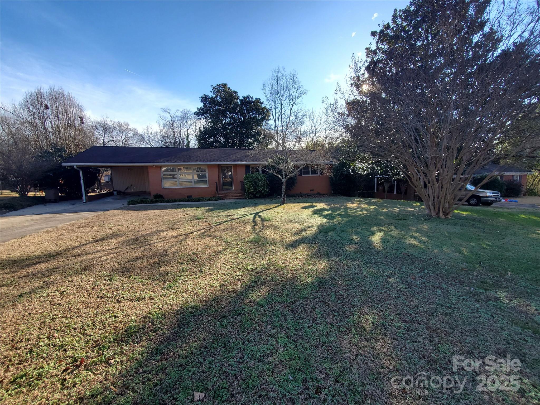 1303 Hunt Street Shelby, NC 28152 - Photo 15 of 16 a view of a house with a yard and garage