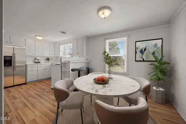 a kitchen with a table and chairs