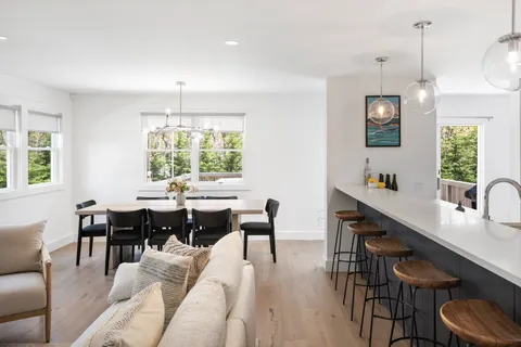a view of a dining room with furniture window and outside view