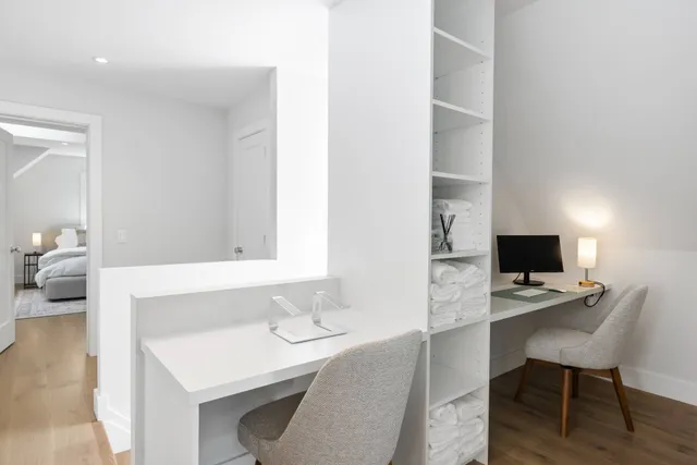 a workspace with furniture and bathroom