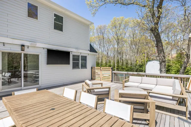 a outdoor space with a couch and wooden floor