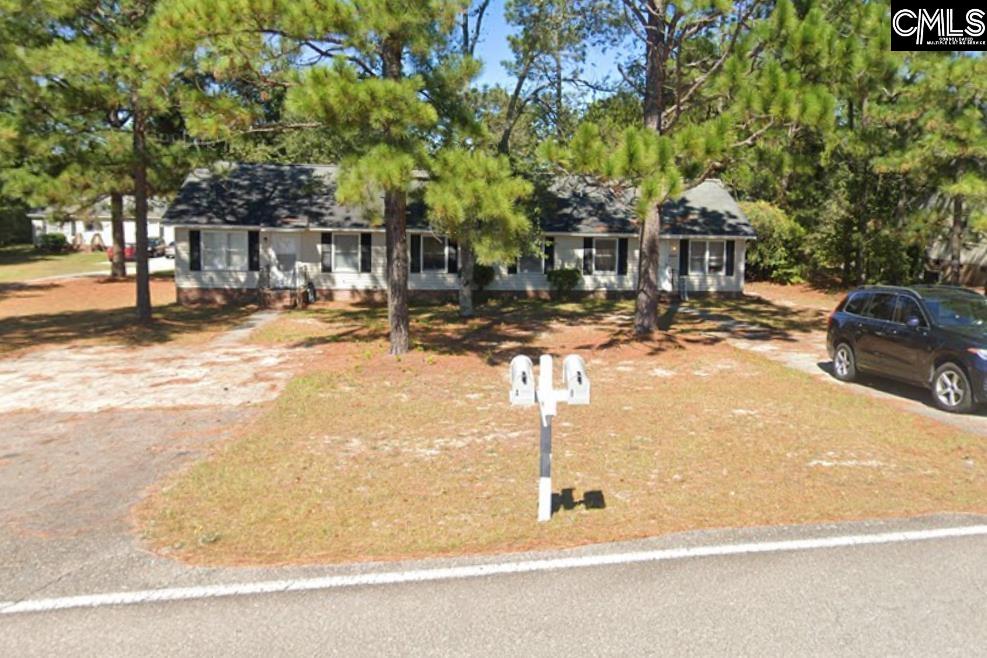 2444 Watson Street, Unit B Elgin, SC 29045 - Photo 1 of 5 a view of street with trees