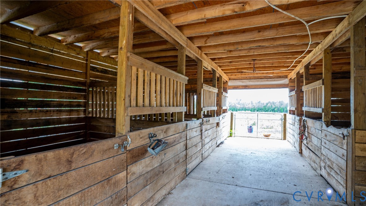 1451 Dixie Hill Road Dillwyn, VA 23936 - Photo 28 of 51 Wood-framed barn featuring multiple stalls with sl