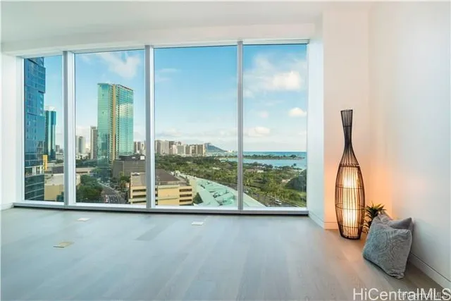 a view of a room with gym equipment and floor to ceiling window
