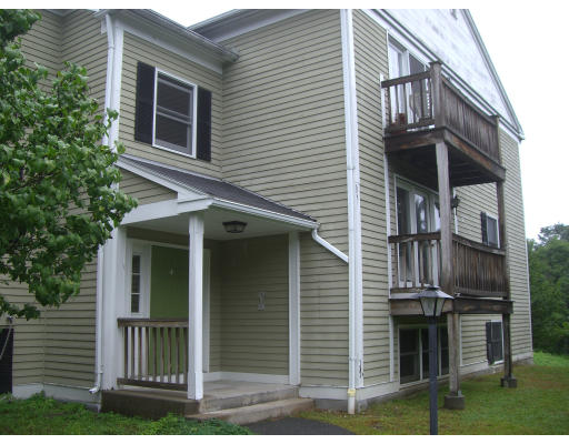 46 Evergreen Road, Unit 109 Northampton, MA 01053 - Photo 2 of 3 a view of front of house with a yard