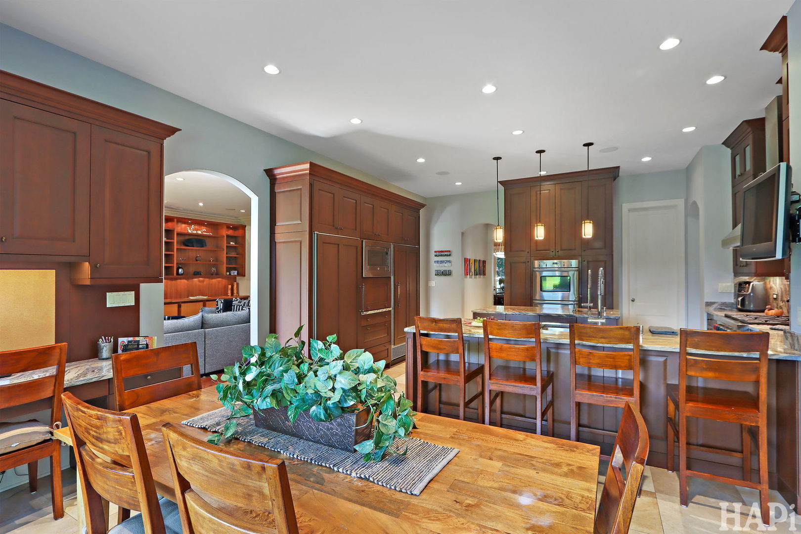 1425 Lee Road Northbrook, IL 60062 - Photo 15 of 53 a living room filled with furniture potted plant and kitchen view