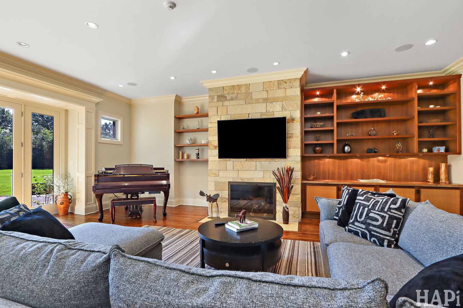 1425 Lee Road Northbrook, IL 60062 - Photo 18 of 53 a living room with furniture a flat screen tv and a fireplace