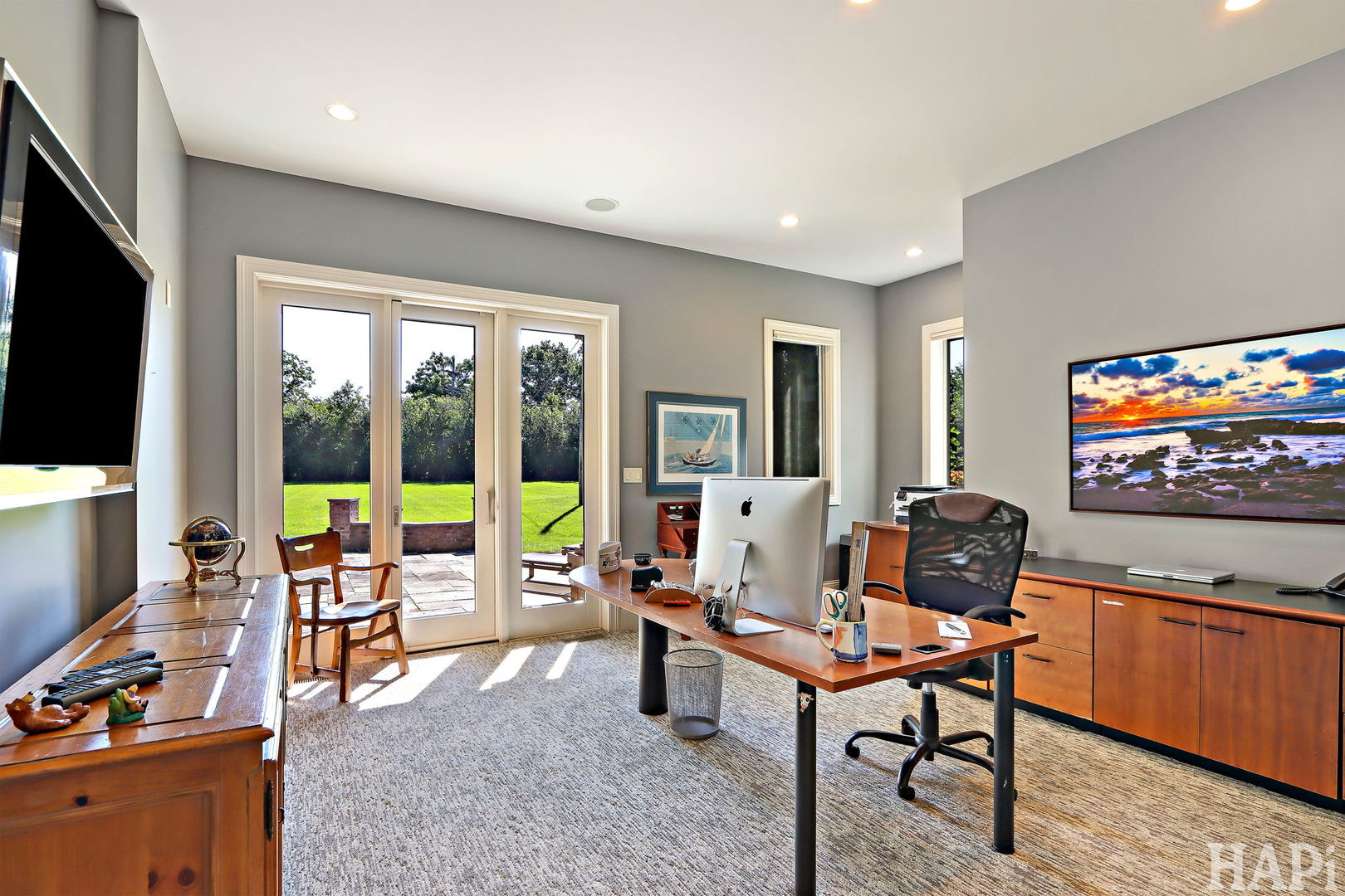 1425 Lee Road Northbrook, IL 60062 - Photo 19 of 53 a living room with furniture a flat screen tv and a floor to ceiling window