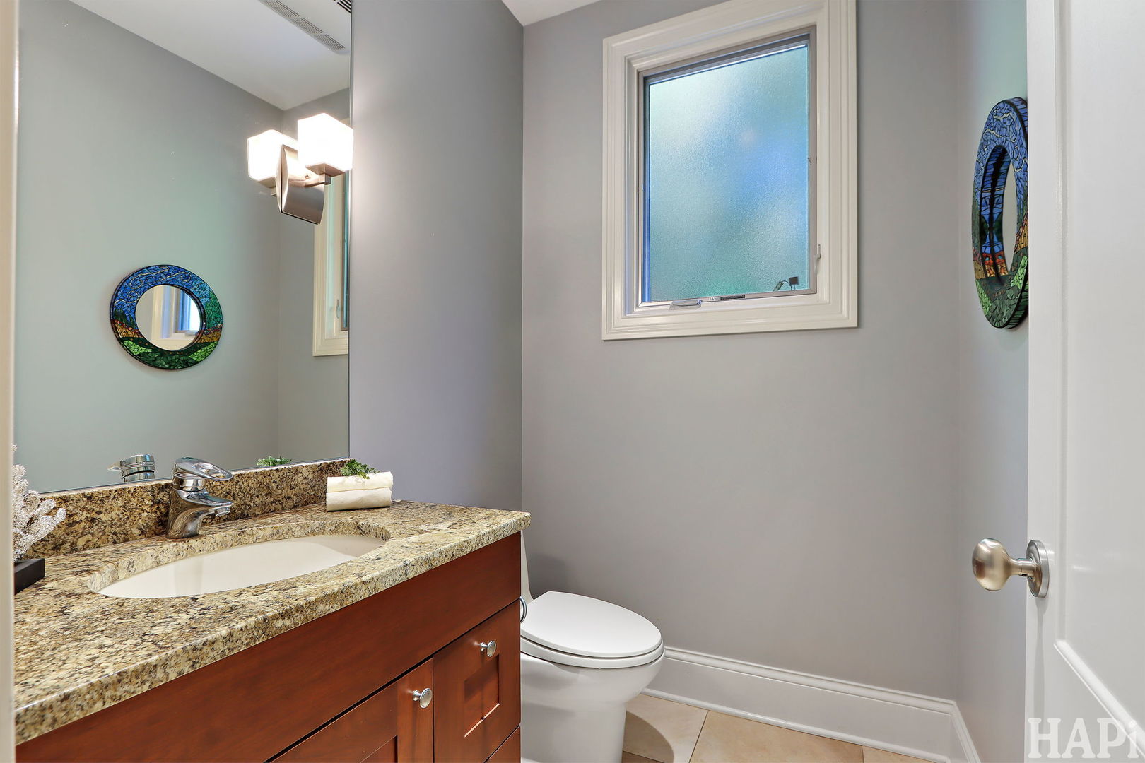 1425 Lee Road Northbrook, IL 60062 - Photo 21 of 53 a bathroom with a granite countertop sink and a mirror