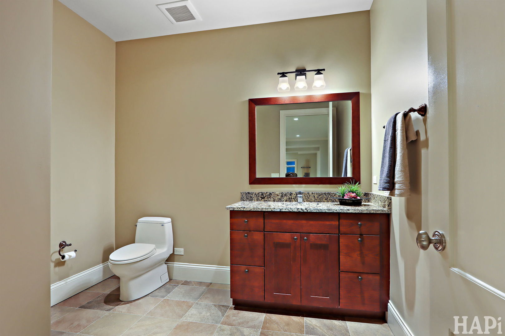 1425 Lee Road Northbrook, IL 60062 - Photo 48 of 53 a bathroom with a toilet sink and mirror