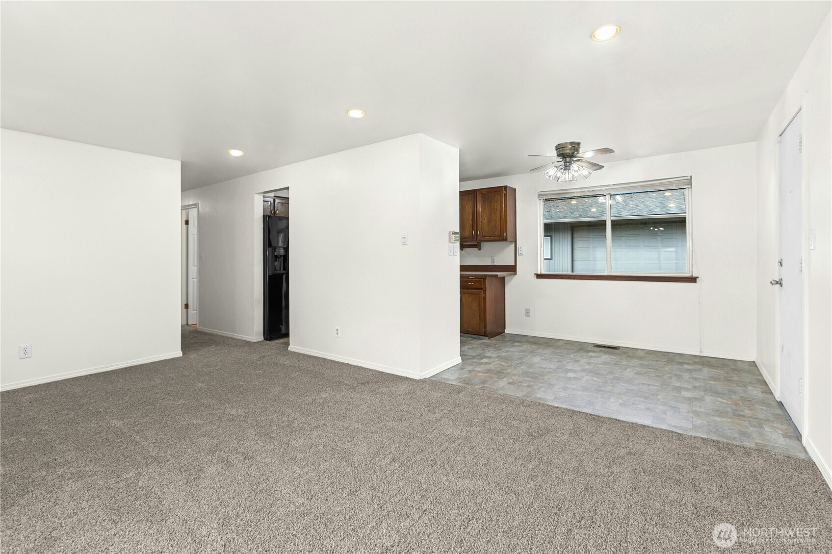 15914 52nd Avenue West Edmonds, WA 98026 - Photo 16 of 29 a view of a kitchen with a sink and a refrigerator