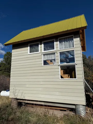 a side view of a house with a balcony