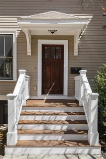 a front view of a house with a porch