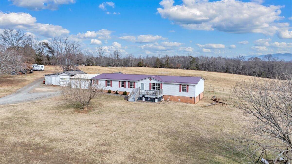 627-641 Novelty Road Penhook, VA 24137 - Photo 63 of 64 a view of a house with a yard and sitting area