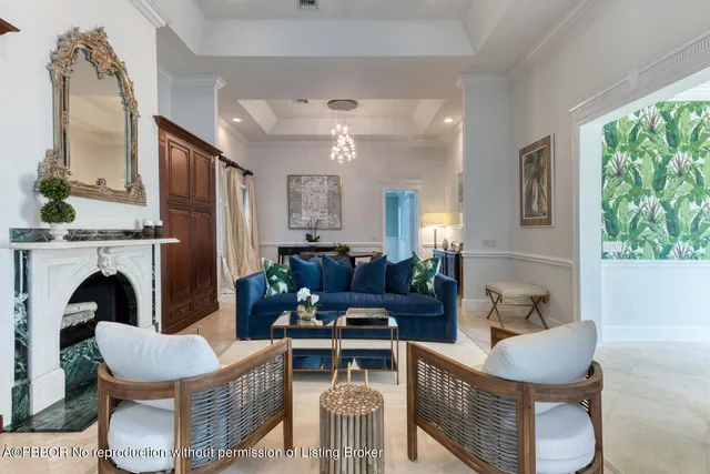 a living room with furniture and a dining table