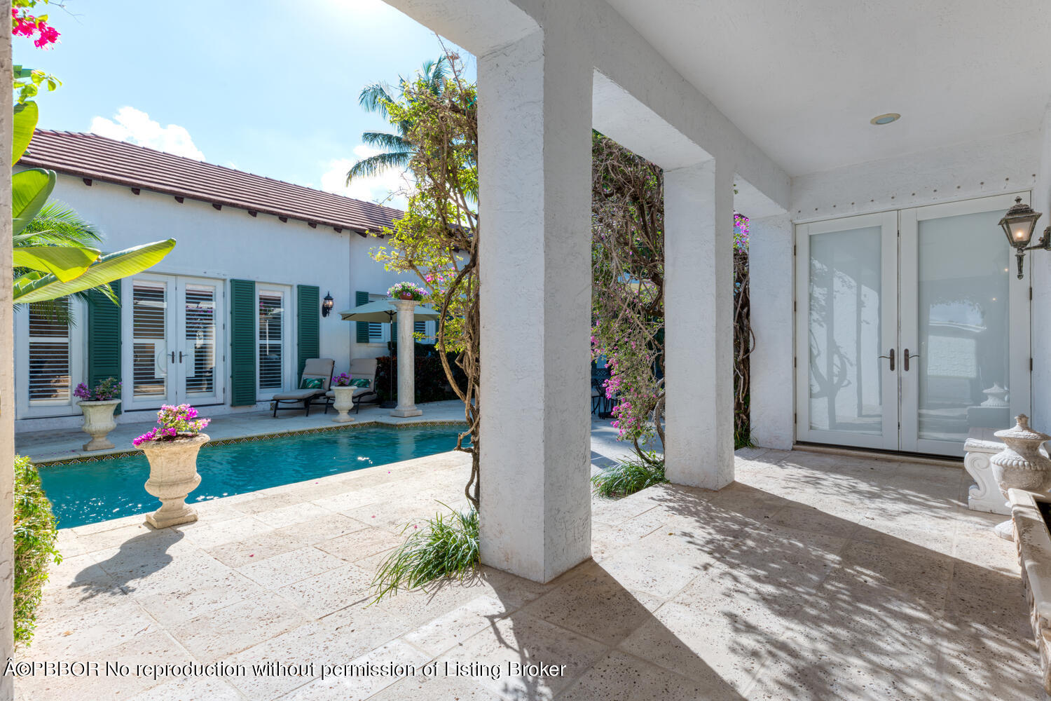 2258 Ibis Isle Road East Palm Beach, FL 33480 - Photo 17 of 31 a front view of a house with garden