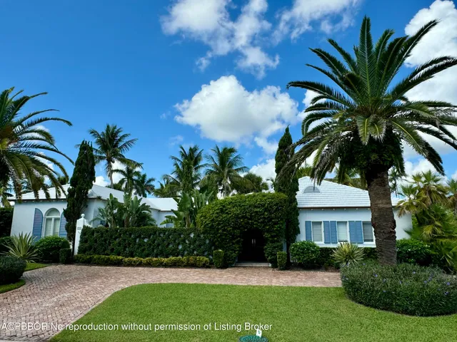 an aerial view of a house with outdoor space and street view