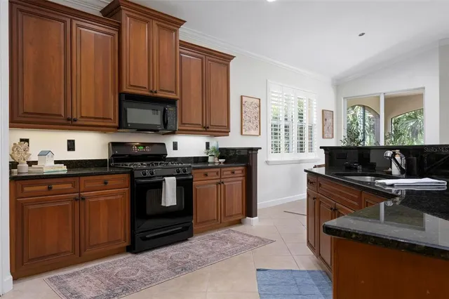 a bathroom with double vanity sinks and a shower